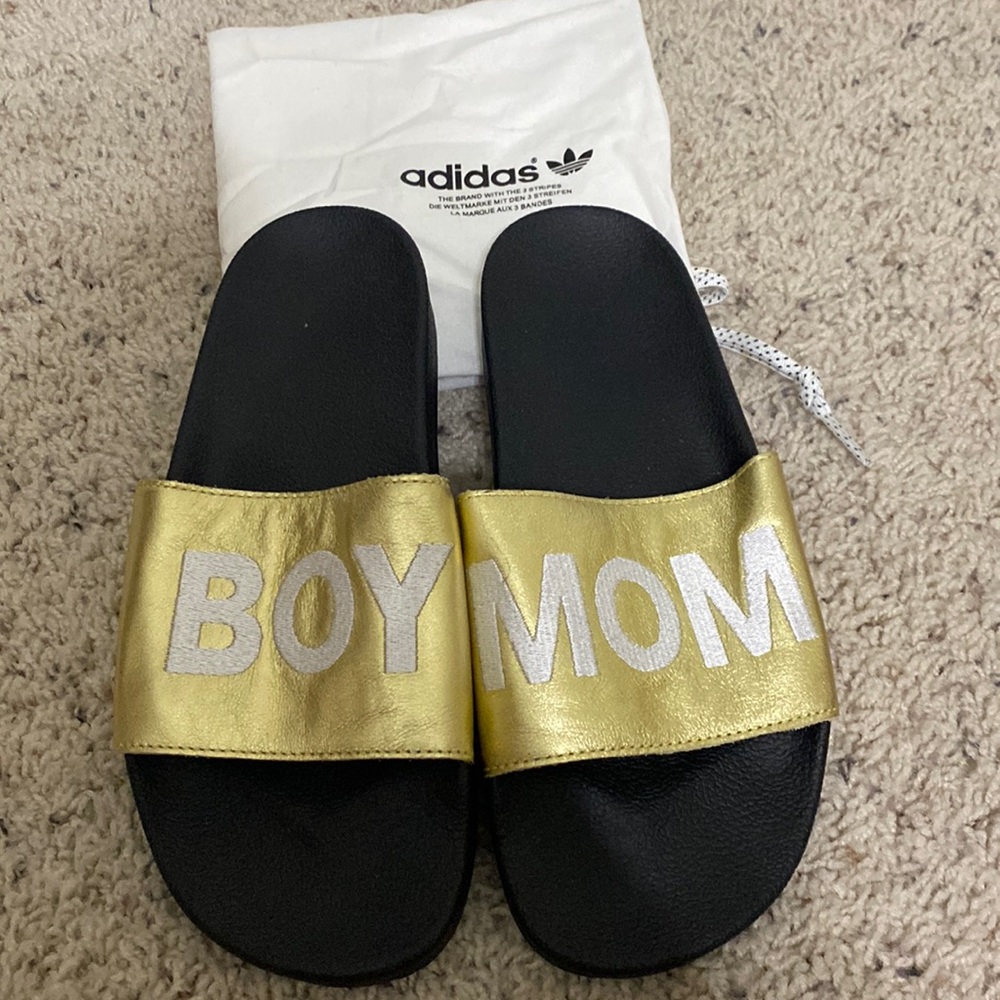 Custom Adidas slides. Gold with “Boy Mom” embroidery. Dust bag included.